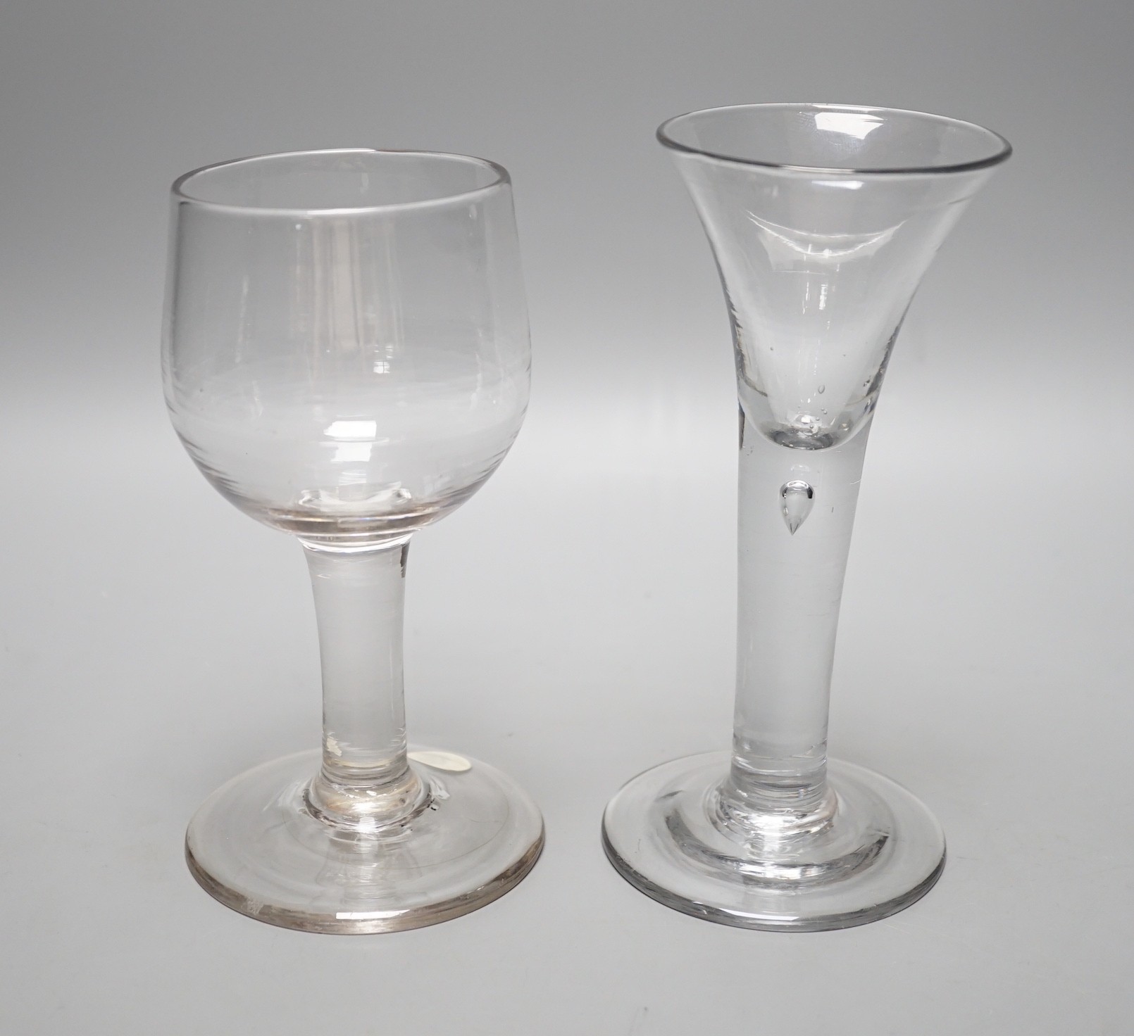 A mid 18th century mead glass and a similar drawn trumpet ale glass, tallest 17cm